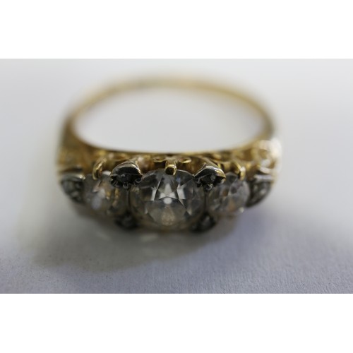 392 - A yellow metal and diamond three-stone dress ring, stamped 18ct and Platinum, size O, 3.6g