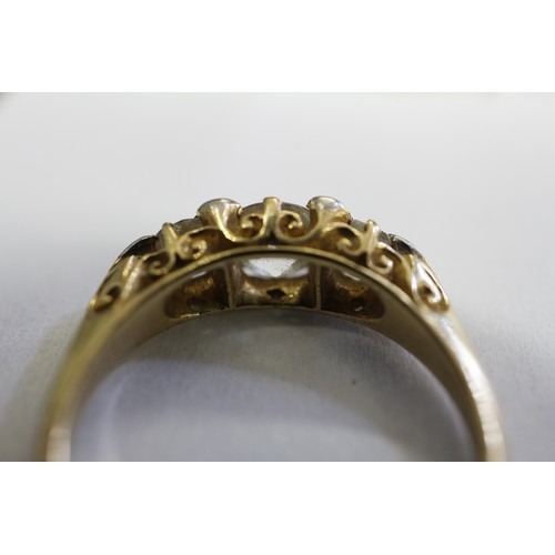 392 - A yellow metal and diamond three-stone dress ring, stamped 18ct and Platinum, size O, 3.6g