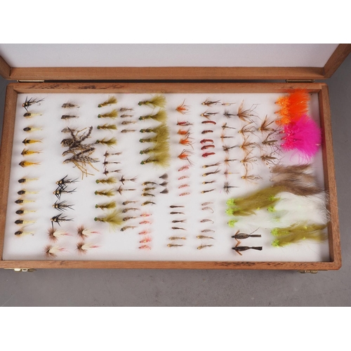 134 - A Richard Wheatley two-division fishing fly box, containing an assortment of flies, 15