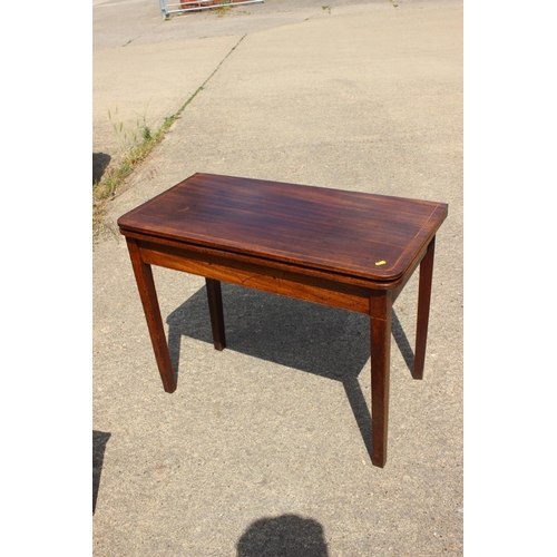 441 - A 19th century mahogany box and ebony line inlaid fold-over top tea table, on square taper supports,... 