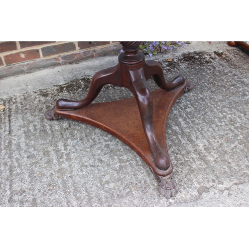 458 - An early 19th century pollard oak single-piece circular tilt top table, on vase turned mahogany colu... 