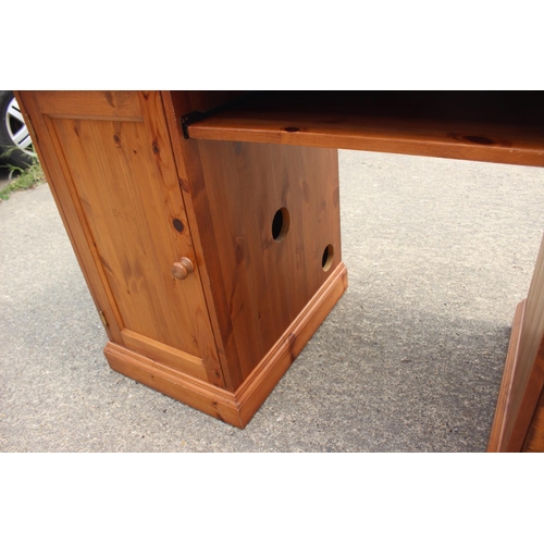 617 - A pine double pedestal desk, fitted cupboard and three drawers, 54