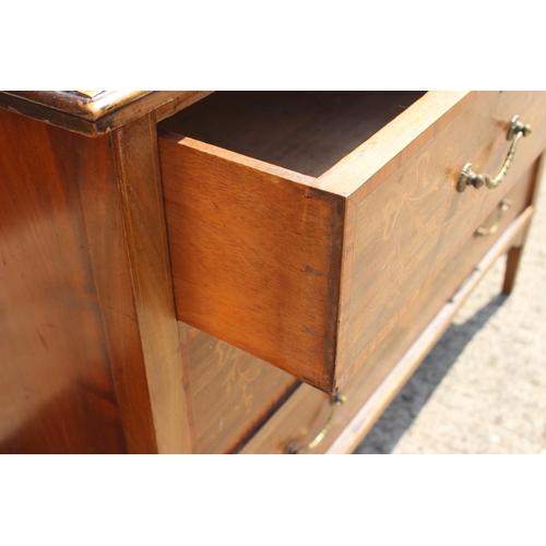 599 - An Edwardian mahogany and inlaid dressing chest of two short  three and two long drawers, on square ... 