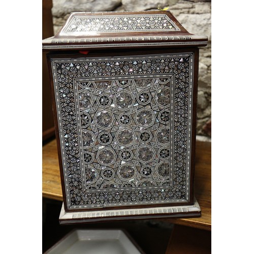 131 - A mahogany and mother-of-pearl inlaid jewellery cabinet, 13