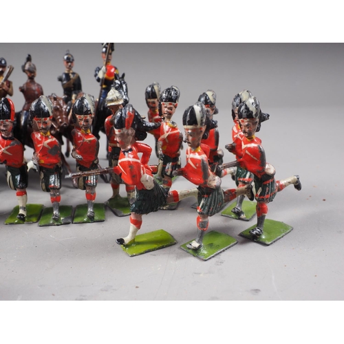 147 - A selection of Britains lead painted toy soldiers including English and Scottish Line Infantry, and ... 