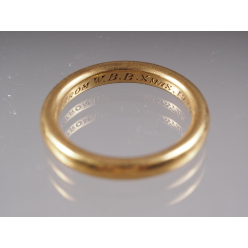 329 - A 22ct gold wedding band, size P, 7.5g