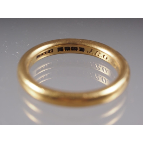 329 - A 22ct gold wedding band, size P, 7.5g