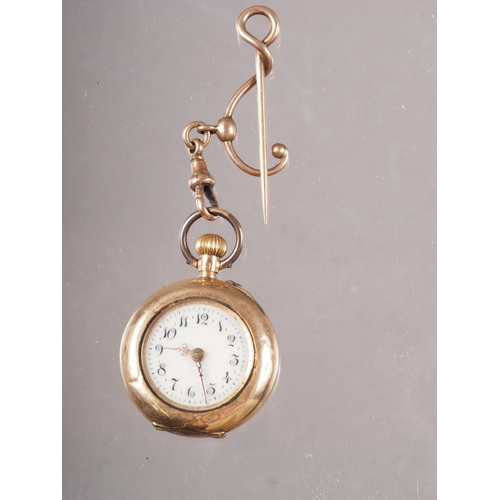 368 - A lady's 14ct gold cased fob watch with white enamel dial and Arabic numerals, the back case decorat... 