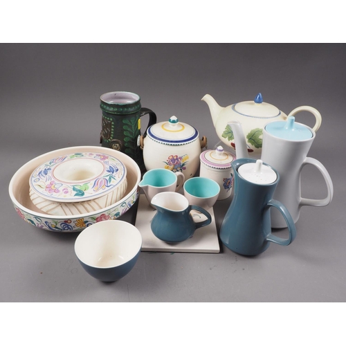 40 - A selection of Poole pottery, including a teapot, two cameo ware coffee pots, a biscuit barrel and o... 