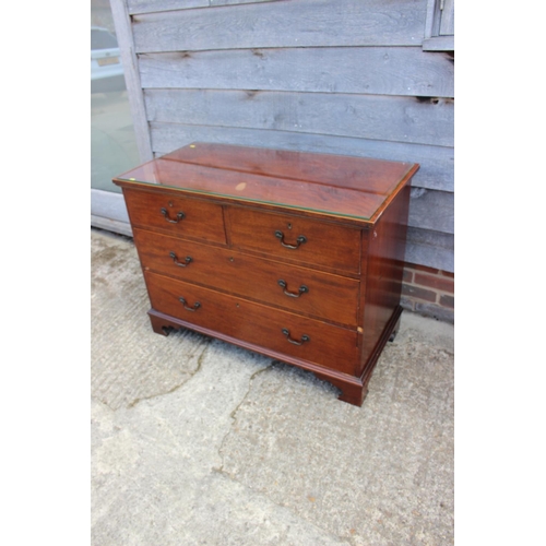 442 - A 19th century mahogany box line inlaid chest of two short and two long graduated drawers with bail ... 