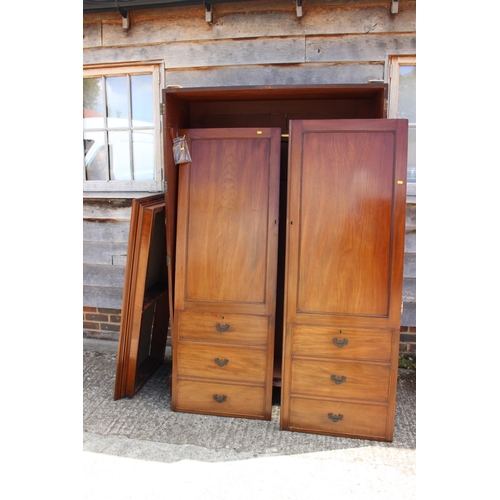 446 - A Victorian mahogany linen press, now a wardrobe, enclosed two doors with faux drawers to base, on b... 