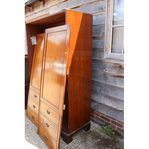 446 - A Victorian mahogany linen press, now a wardrobe, enclosed two doors with faux drawers to base, on b... 