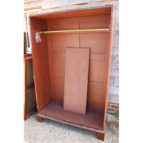 446 - A Victorian mahogany linen press, now a wardrobe, enclosed two doors with faux drawers to base, on b... 