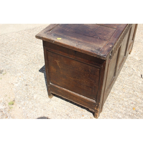 449 - An 18th century oak triple panel front coffer, on stile supports, 44