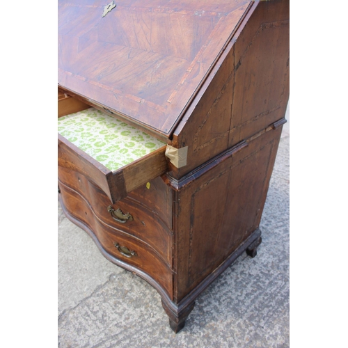 466 - An early 19th century Genoese walnut and banded serpentine front bureau with fitted interior over tw... 