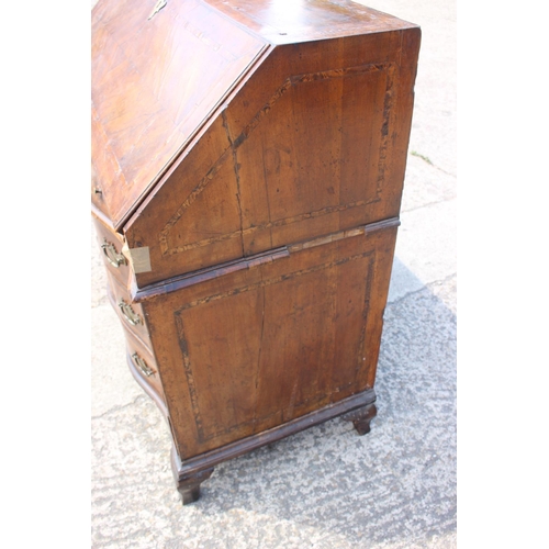 466 - An early 19th century Genoese walnut and banded serpentine front bureau with fitted interior over tw... 