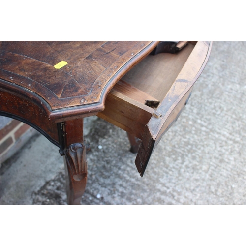 467 - An early 19th century Italian walnut and banded serpentine front side table, fitted one drawer, on s... 