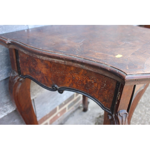 467 - An early 19th century Italian walnut and banded serpentine front side table, fitted one drawer, on s... 