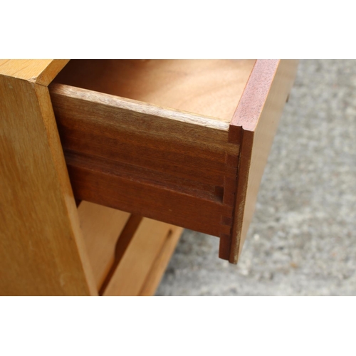 506 - A 1950s light oak dressing table, fitted three drawers and full length mirror, 34