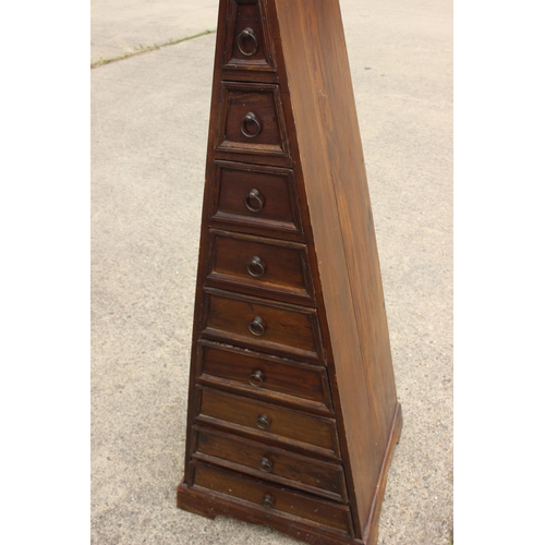 507 - A pyramid shape chest of nine drawers with ring handles, on bracket feet, 20 1/2