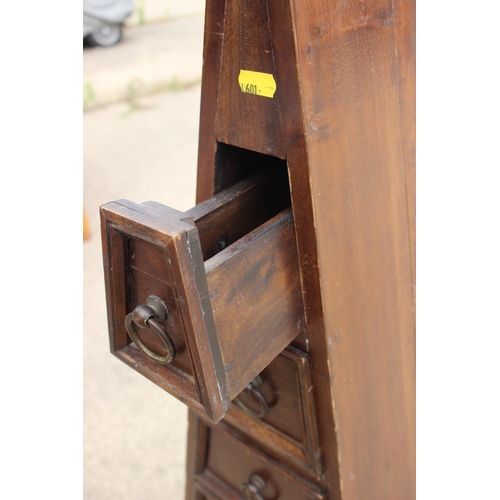 507 - A pyramid shape chest of nine drawers with ring handles, on bracket feet, 20 1/2