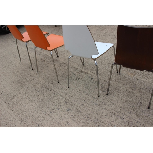 509 - A set of three 1970s laminate dining chairs, on chrome supports, and a similar oak chair