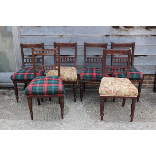 529 - A Harlequin set of six Edwardian walnut dining chairs with shell carved top rails and stuffed over s... 