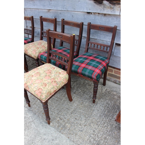 529 - A Harlequin set of six Edwardian walnut dining chairs with shell carved top rails and stuffed over s... 