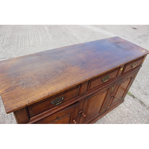 534 - A Titchmarsh & Goodwin oak dresser base of 17th century design, fitted three drawers over three ... 