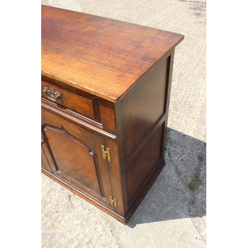 537 - A Titchmarsh & Goodwin oak sideboard, fitted two drawers over cupboards enclosed two arch top do... 