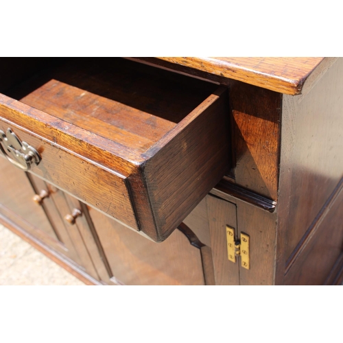 537 - A Titchmarsh & Goodwin oak sideboard, fitted two drawers over cupboards enclosed two arch top do... 