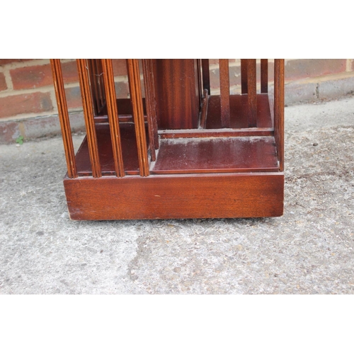 550 - A mahogany and inlaid revolving two-tier bookcase, 18