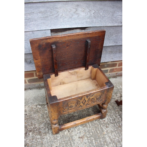 558 - A carved oak box seat stool of 17th century design, on turned and stretchered supports, 20