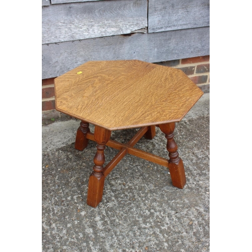 564 - A light oak three-tier folding cake stand, and a light oak octagonal top occasional table, on turned... 