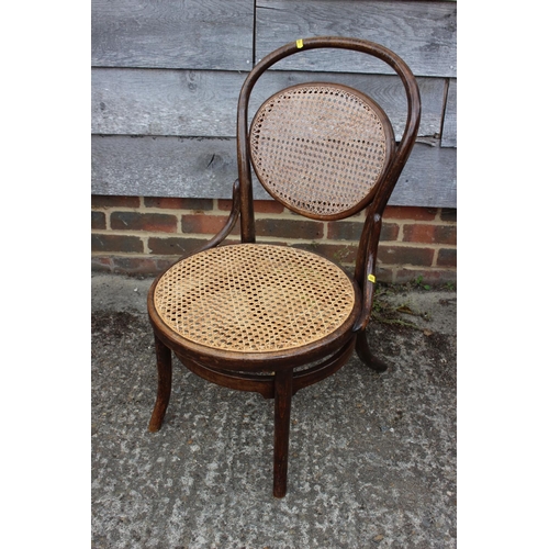 565 - A pair of vertical rail back cane seat bedroom chairs and a bentwood cane back side chair