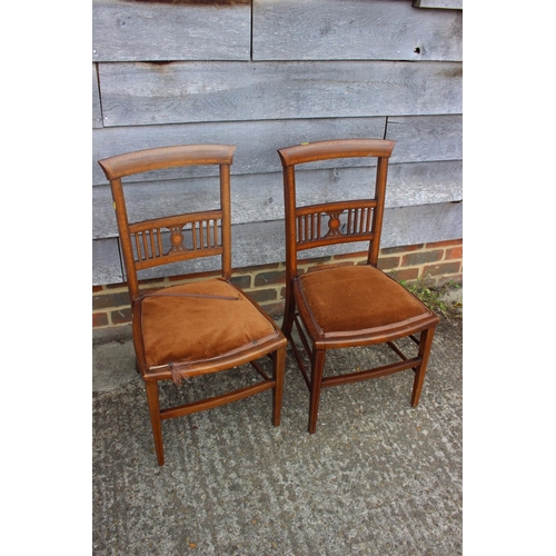 568 - A late 19th century walnut and line inlaid two-seat vertical rail back and pierced splat back settee... 