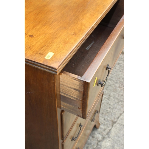 570 - A walnut chest of four long graduated drawers, on splay bracket supports, 21 1/2