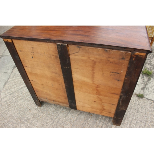 581 - An Edwardian walnut, box and ebony strung chest of two short and three long graduated drawers with r... 