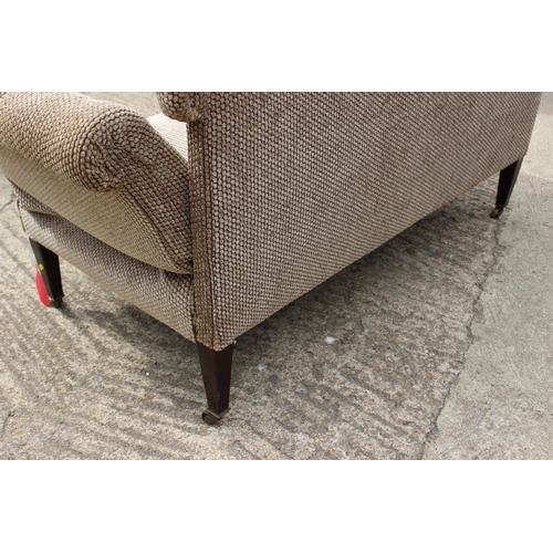 583 - An Edwardian drop end two-seat settee, button upholstered in a mushroom textured fabric, on square t... 