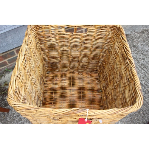 587 - A wicker log basket, 24