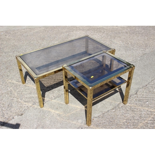 601 - A 1970s brass framed glass top coffee table, 38