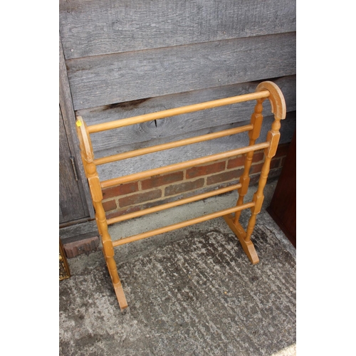 603 - A polished beech towel rail