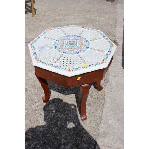 604 - An Agra ware pierced marble and inlaid octagonal low occasional table, on cabriole supports, 20