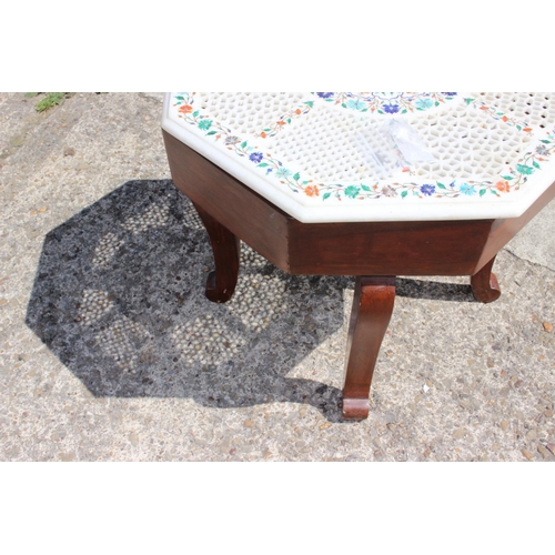 604 - An Agra ware pierced marble and inlaid octagonal low occasional table, on cabriole supports, 20