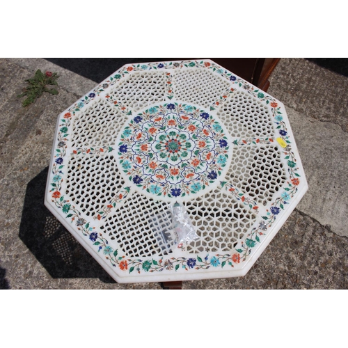 604 - An Agra ware pierced marble and inlaid octagonal low occasional table, on cabriole supports, 20