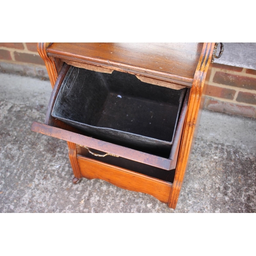 606 - An Edwardian carved walnut coal purdonium with raised mirror back panel front, on block base, 17 1/2... 