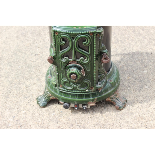 629 - A Godin green and black enamel stove (gas fired), 14