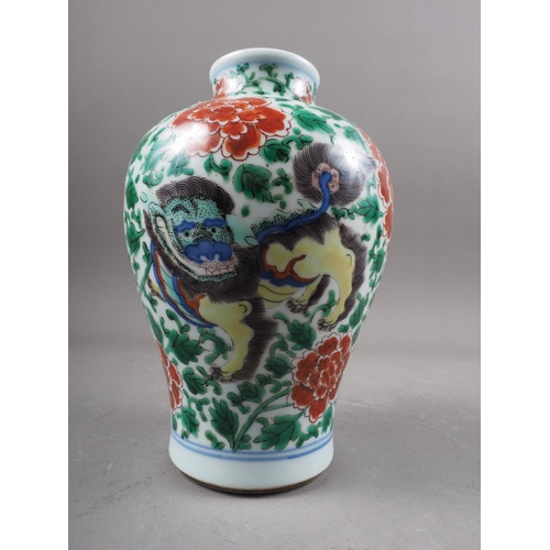 77 - *A Chinese famille verte baluster vase with mythical beast, chrysanthemum and leaf decoration, 7 1/4... 