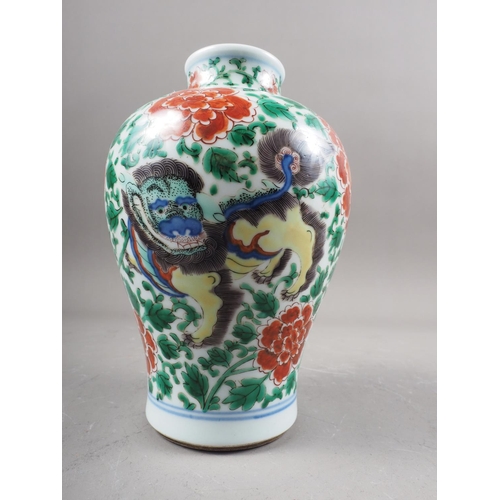 77 - *A Chinese famille verte baluster vase with mythical beast, chrysanthemum and leaf decoration, 7 1/4... 