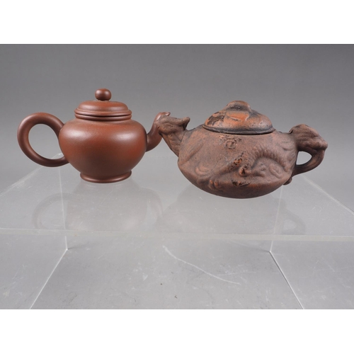 79 - *A Chinese Yixing pottery miniature teapot with relief dragon decoration and seal mark to base, 2 1/... 